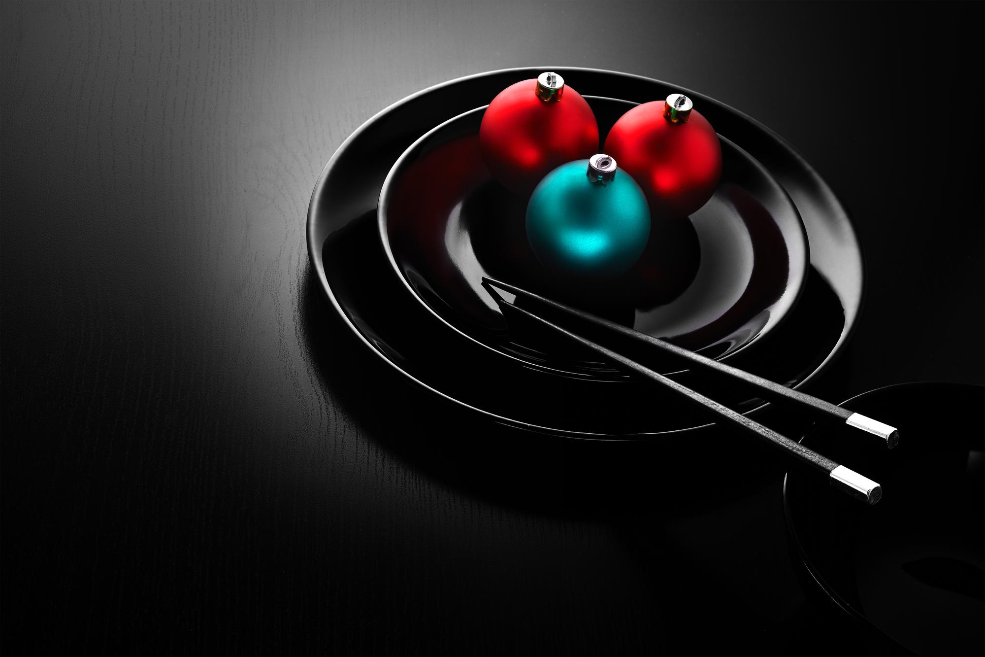 Chefs with futuristic plating on dark table